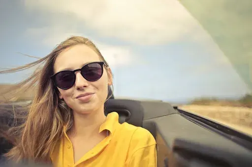 Woman with glasses smiling