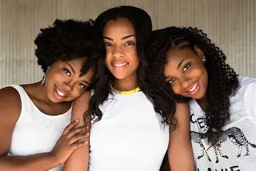 Three woman posing for a photo